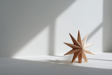 beautifully crafted wooden christmas star sits elegantly against clean white background
