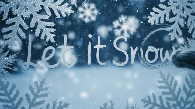 Woman hand writing Let it Snow message with snow during winter season. Christmas and new year 2026 festive background.