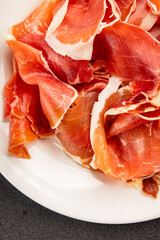 jamon serrano meat appetizer jamon iberico natural product tasty snack fresh delicious gourmet food background on the table rustic top view copy space