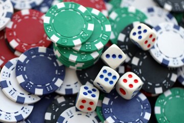 Dice game on the poker table in the casino. A successful combination of dice brought a lot of winning chips