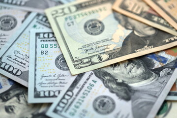 Big amount of different dollar bills close up. Hundred fifty twenty ten and five dollar banknotes