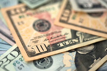 Big amount of different dollar bills close up. Hundred fifty twenty ten and five dollar banknotes