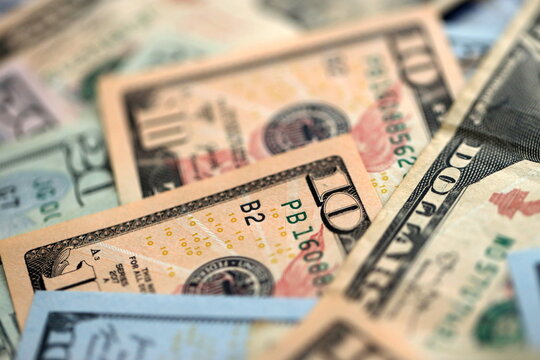 Big amount of different dollar bills close up. Hundred fifty twenty ten and five dollar banknotes