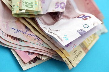 Big amount of different Ukrainian hryvnia money bills. Pile of crumpled ukrainian banknotes