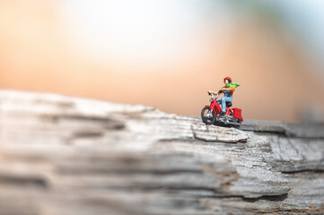 Miniature figurine of man travelling on motorcycle
