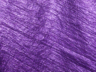 Purple background. Violet fabric. Purple fabric background. Luxurious textile surface. Abstract violet background or template. Fabric shiny glitter texture. Luxurious background. Purple aesthetic. 