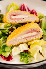 Cordon bleu cutlet meat dish French cuisine vegetable dish natural product tasty snack fresh delicious gourmet food background on the table rustic top view copy space