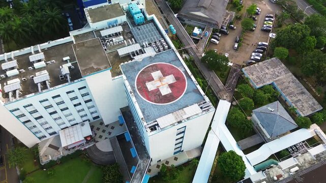 Aerial View of Hospital Building with Helipad on Roof