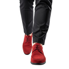 Close-up of legs wearing black pants and red suede dress shoes