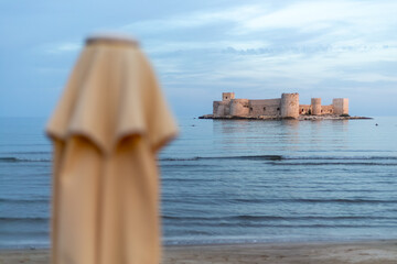 The famous historical Maiden's Castle in the Erdemli district of Mersin, Turkey. Known as Kız Kalesi in Turkish. Holiday concept with view of Maiden's Castle.