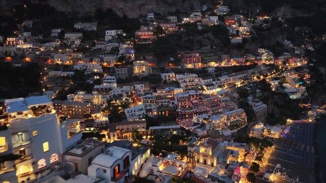Night aerial of beautiful illuminated buildings of Positano Italy Amalfi Coast