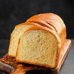 Brioche bread slices bakery pastry natural product tasty snack fresh delicious gourmet food background on the table rustic top view copy space