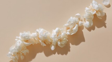 Elegant peony arrangement on beige background, ideal for design use.