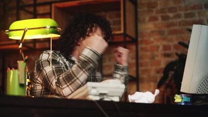 Male programmer from 80s creating new software, celebrating program launch