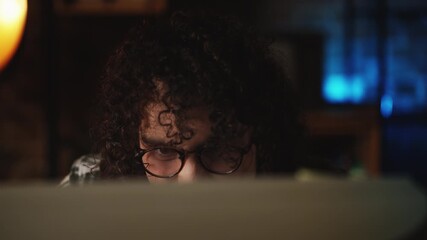 Annoyed male IT specialist having program issues while working on retro computer