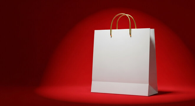 White shopping bag with handles on red background for Christmas concept