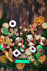 Sweet Christmas cookies on rustic table, top view