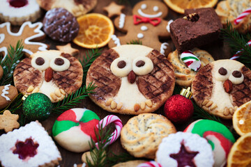 Sweet Christmas cookies on rustic table, top view