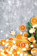 Top view of dried oranges on Holiday Christmas background, gray and yellow