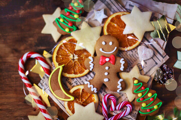 Gingerbread man Christmas cookies on holiday background, top view