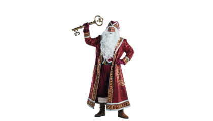 A man dressed as a traditional festive figure holds a large ornate key while wearing a red and gold robe and hat no background