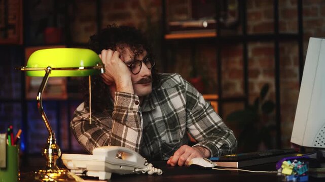 Male programmer falling asleep while working in 90s office, missed deadline