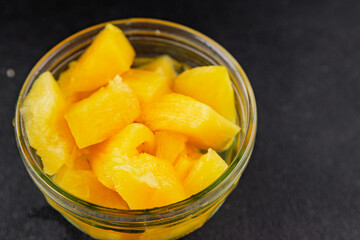 Pineapple canned chunks sweet fruit dessert tasty snack fresh delicious gourmet food background on the table rustic top view copy space keto and paleo diet vegetarian and vegan food