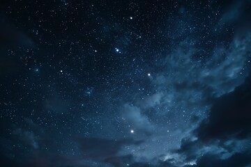 Starry night sky with clouds and distant stars