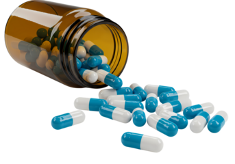Spilled medicine bottle with blue and white capsules