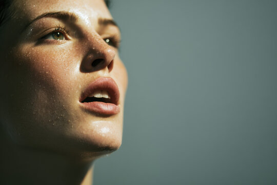 closeup of lips and breath after intense workout showing emotional expression