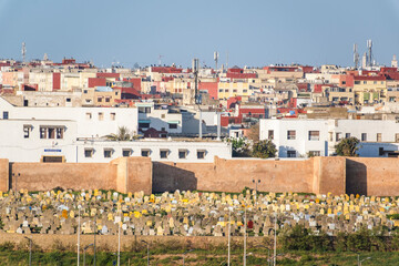 Obraz premium Rabat, Morocco – Traditional Narrow Street in the Medina with Whitewashed Walls and Wooden Doors