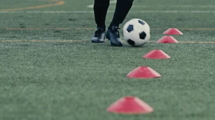 4K Ultra HD footage of football soccer training session, showing players practicing drills, teamwork, passing, and movement on the field, highlighting athletic skill and coordination. - Powered by Adobe