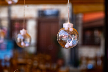 Hanging decorative bulbs with soft bokeh on a street in Kaleici, Antalya. Warm light, shallow depth of field and a cozy outdoor atmosphere.