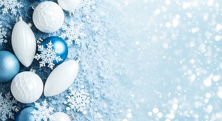 Festive blue and white christmas ornaments and snowflakes on a sparkling background