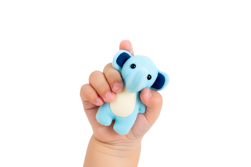 Baby's tiny hand grasping cute soft blue elephant toy, representing early development, playtime, the bond between infant and toy