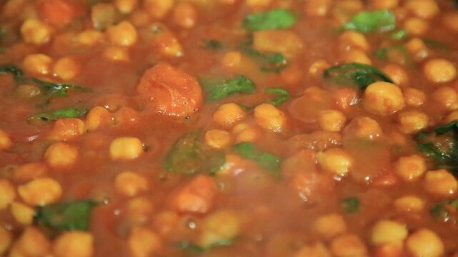 Comfort food. Chana Masala - Chickpea Masala. A chickpea, sweet potato and Garam masala curry cooking in the pot.