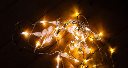 Warm White LED String Lights on Wooden Surface