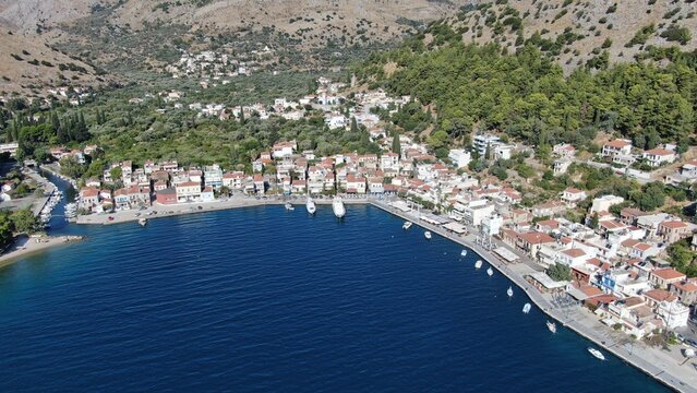 deAerial drone photographs of Lagkada, a picturesque seaside village on the northeastern coast of Chios Island, Greece. These images capture the unique charm of the harbor village, with its smallfault