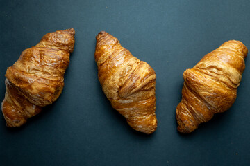 Fresh Croissants on Dark Background