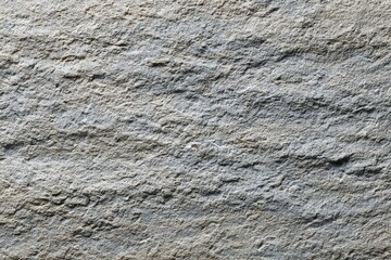 Natural stone-like texture with organic lines, showcasing depth and layers in shades of light gray to beige, ideal for background or design projects