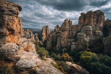 Majestic rock formations showcasing diverse textures and layers, surrounded by lush greenery, under dramatic cloudy skies highlighting nature's stunning beauty