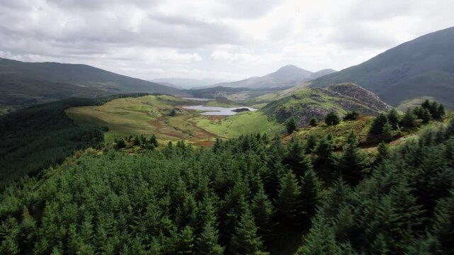 Landscape Aerial shot of Forests, Lakes, Mountains in Snowdonia National Park, Wales