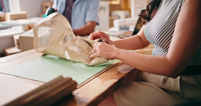 Hands, woman and wrapping product for ecommerce order, supply chain and inventory for delivery. Person, packaging and logistics for shipping, export process and commercial seller of customer purchase