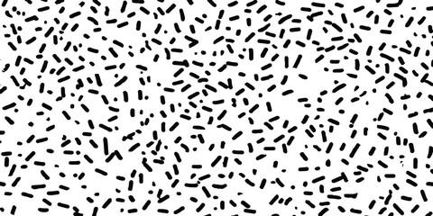 Abstract black dot pattern on white background. Black speckles scattered across white background dots spots. 