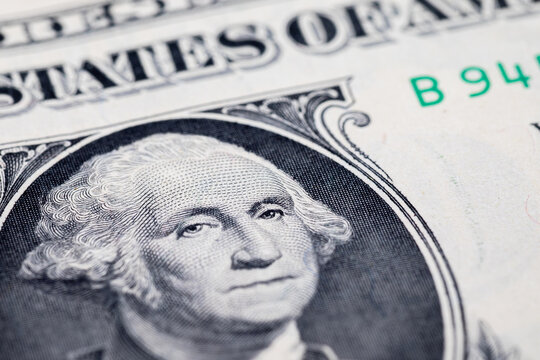 Fragment of 1 US dollar with a portrait of the first president George Washington. United States of America money