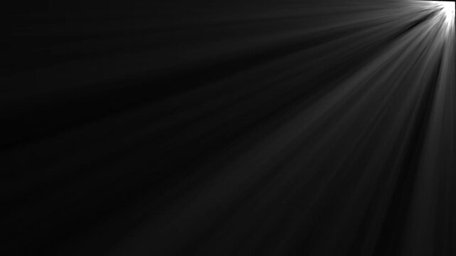 Dramatic light rays emanating from top right corner black background abstract background effect