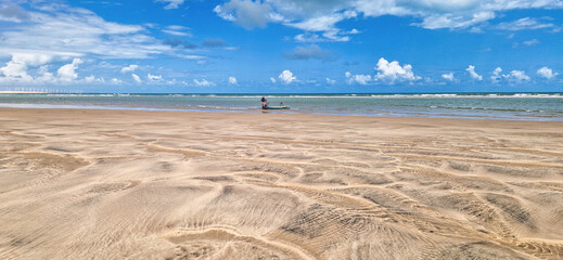 Fishermen at Canoa Quebrada Beach at Aracati in Ceara, Brazil. Bay Coastline