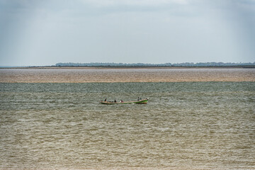 The meeting of the blue waters of the Tapajos River and muddy of the Amazon River in Santarem, Para State, Brazil.