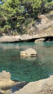 Sea and hidden paradise beach, vertical video.