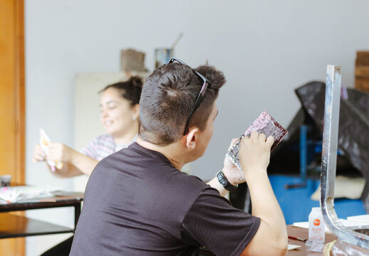 Art students creating craft projects in a classroom workshop, learning and developing creative skills - Powered by Adobe